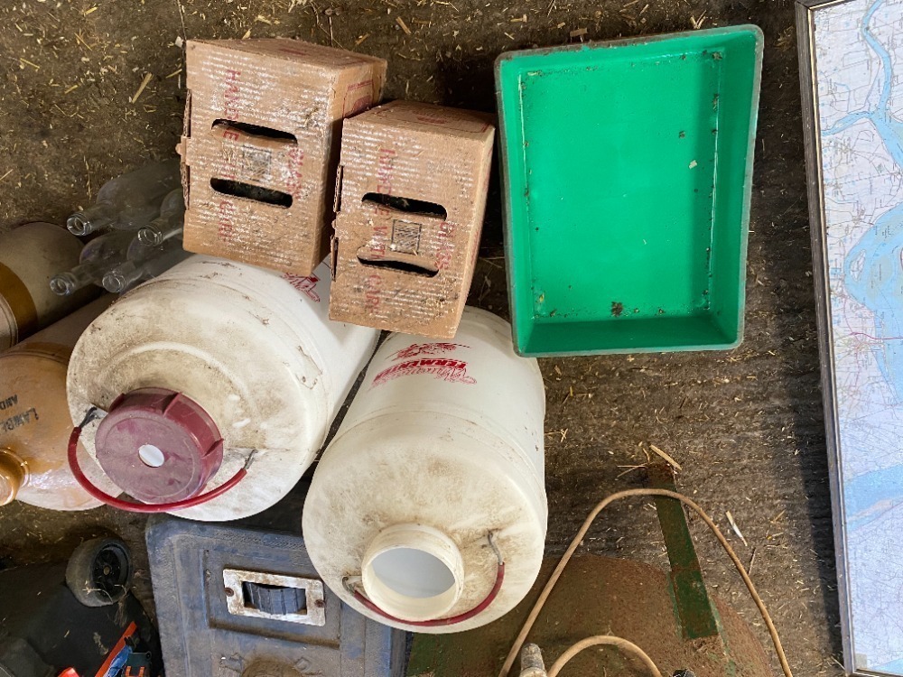 2 Wine Fermenters with Empty Glass Bottles and Trays